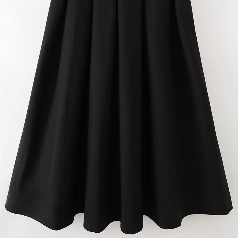 Robe midi noire à épaules structurées