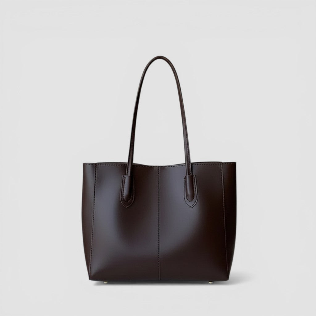 Loceor large brown smooth faux leather tote bag with long shoulder straps and interior pocket.