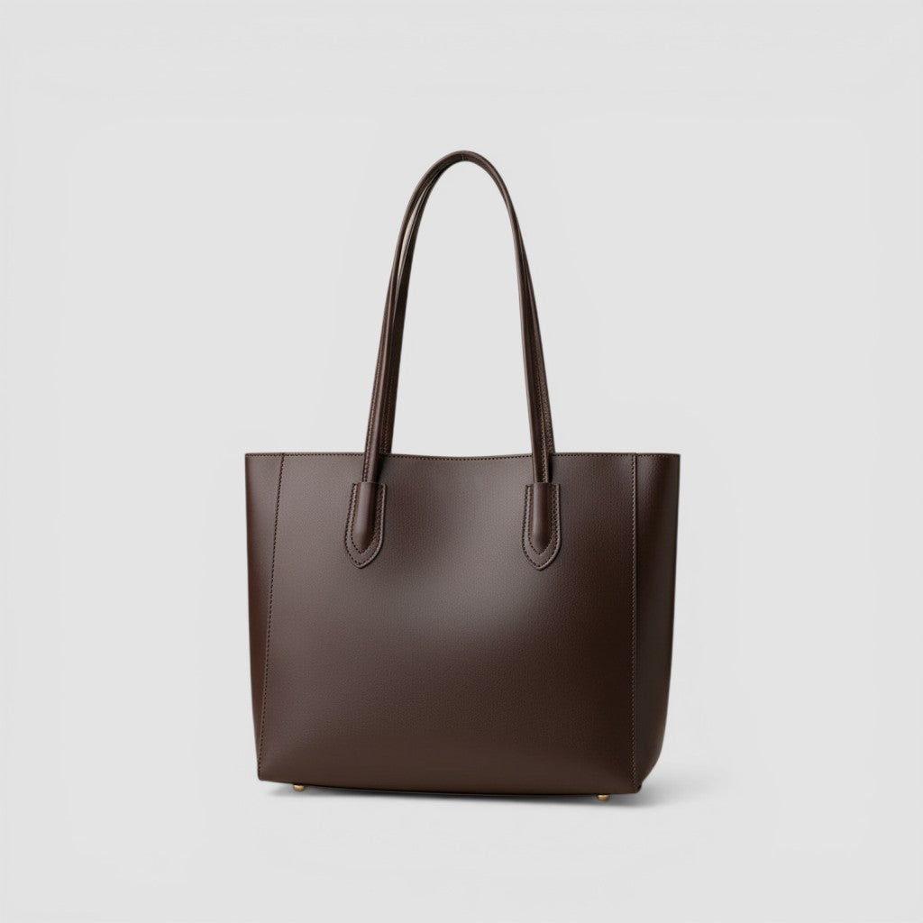 Loceor dark brown smooth faux leather large tote bag with long shoulder straps and snap closure.
